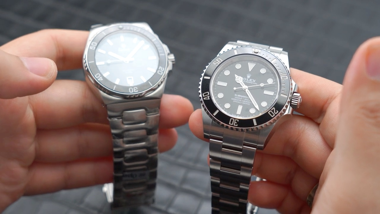 Rolex Submariner 124060 và Tutima Seven Seas S đặt cạnh nhau ở góc nghiêng