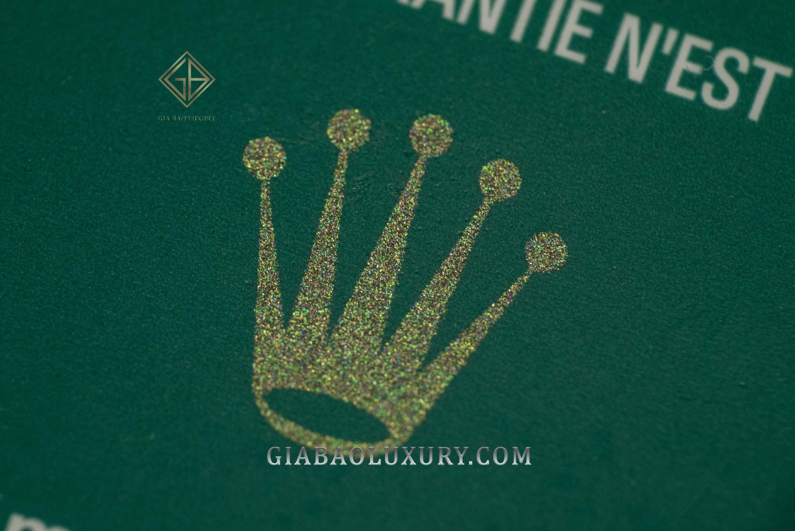 Vương miện ánh kim trên thẻ bảo hành Rolex xanh trắng